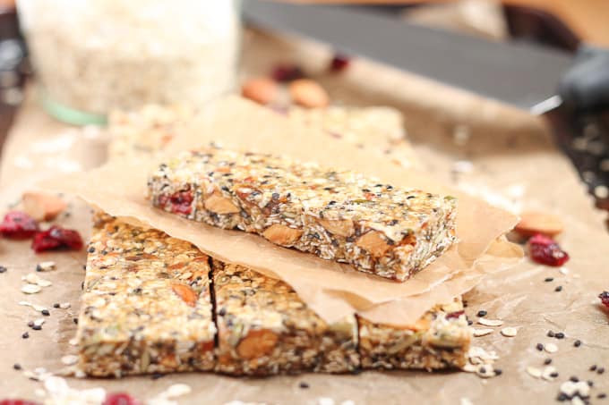 Healthy Fruit Nut and Seed Bars stacked on parchment paper