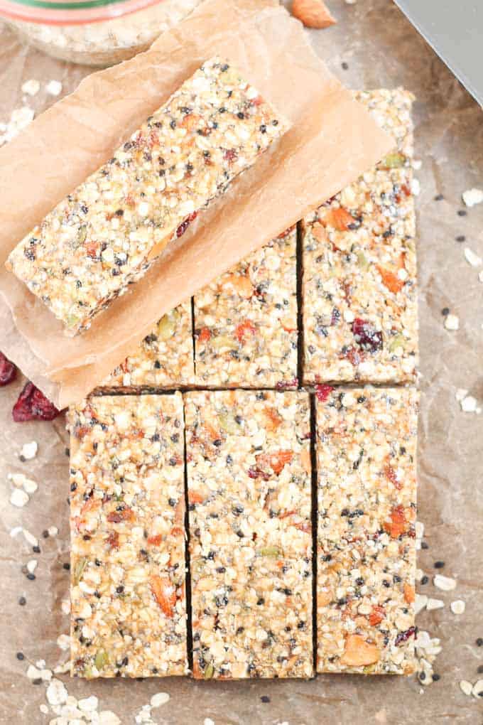 Healthy Fruit Nut and Seed Bars stacked on parchment paper