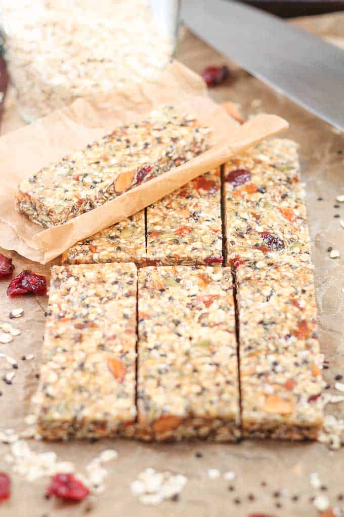 Healthy Fruit Nut and Seed Bars stacked on parchment paper