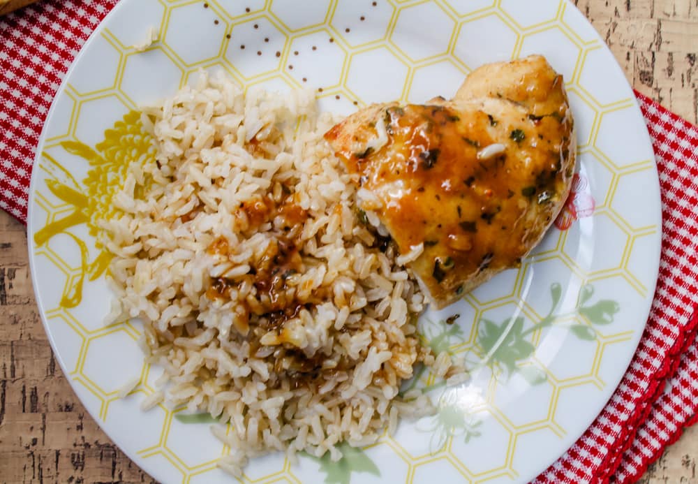 a plate of chicken and rice.