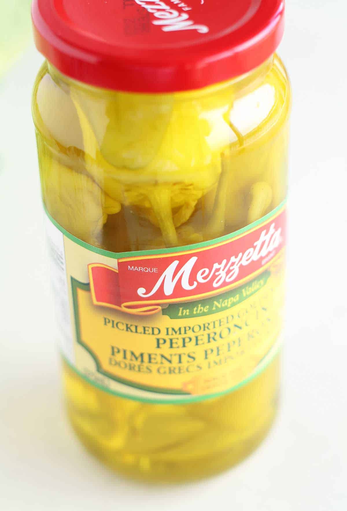 pickled pepperoncini in a jar