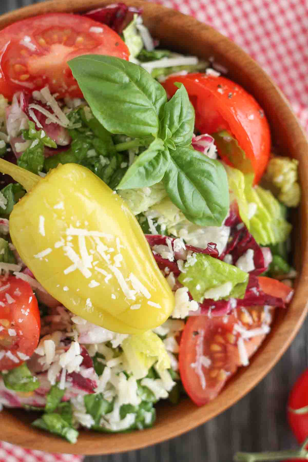 Italian Cold Rice Salad in a wooden bowl