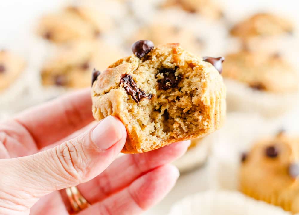 a gluten free banana muffin with a bite out of it.