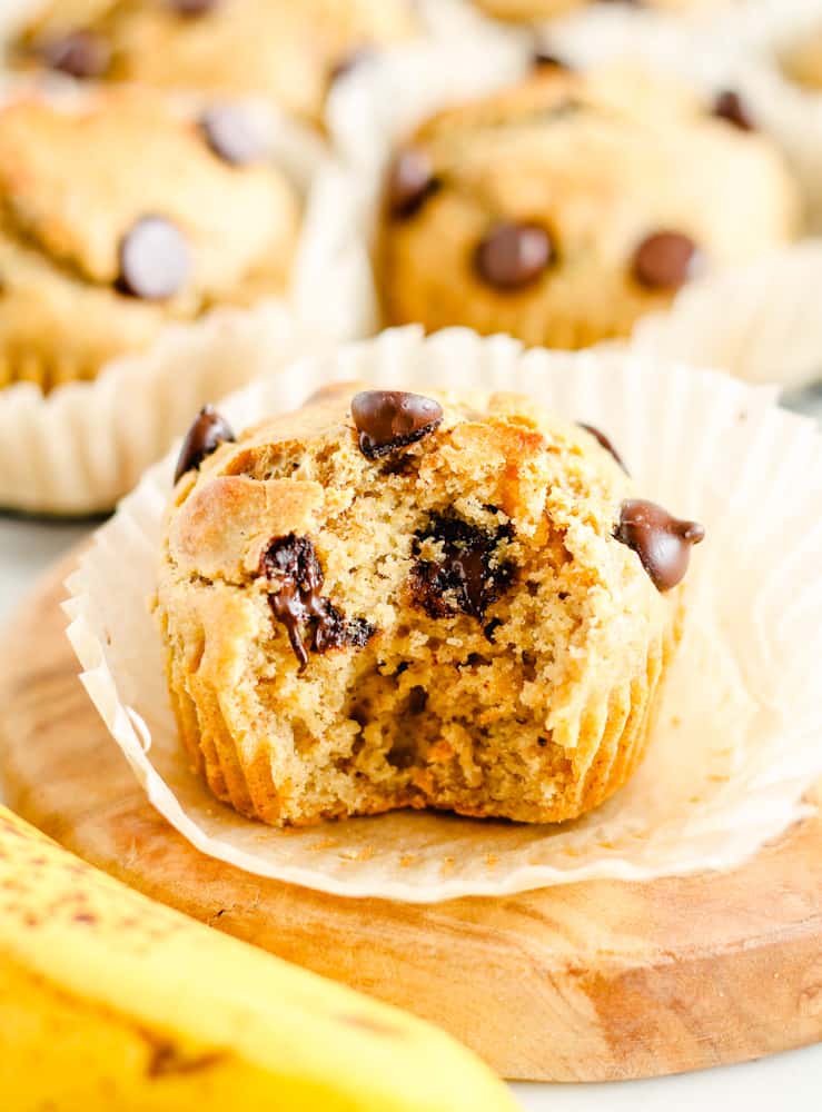 a gluten free banana muffin with a bite out of it.