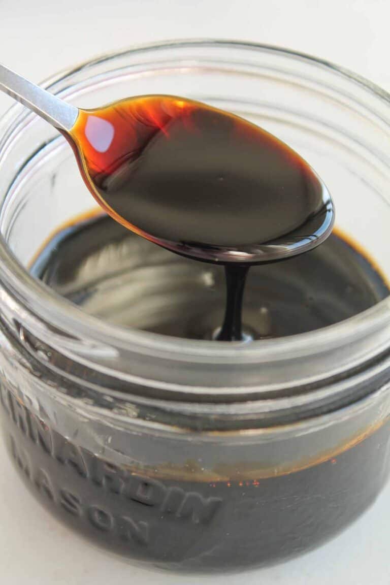 a spoon in a jar of homemade balsamic glaze