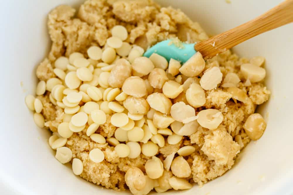cookie ingredients being stirred in a mixing bowl.