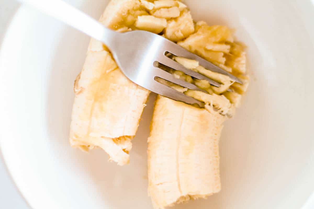 bananas being mashed by a fork