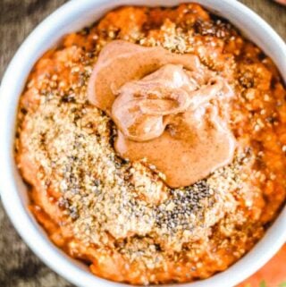 a sweet potato breakfast bowl topped with ground flax seed and chia seeds