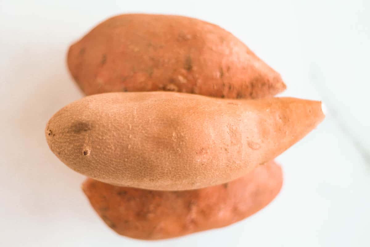 sweet potatoes on a counter.