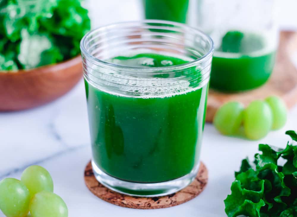 a glass of fresh green juice