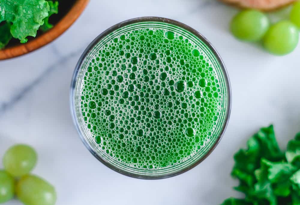 a glass of fresh green juice