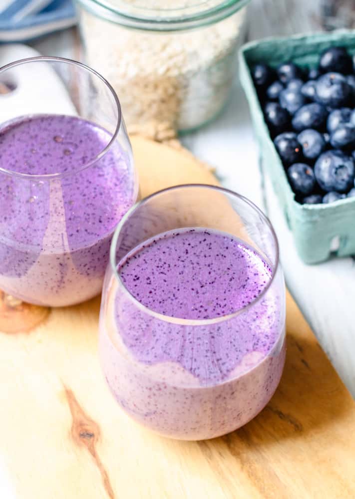 two glasses of blueberry oatmeal smoothie.