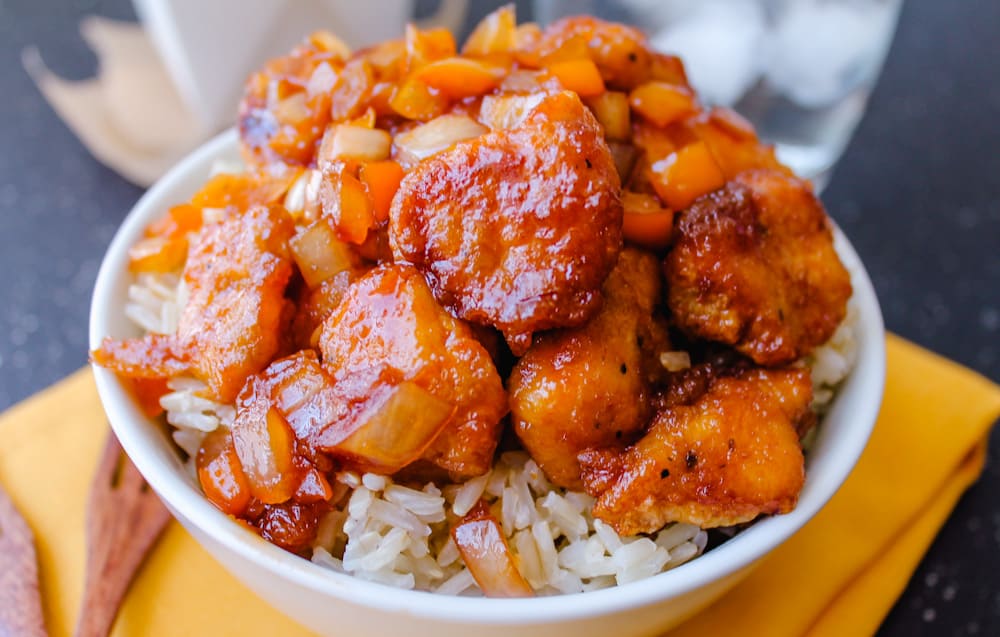 a bowl of sweet and sour chicken.