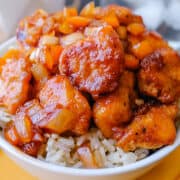 a bowl of sweet and sour chicken.