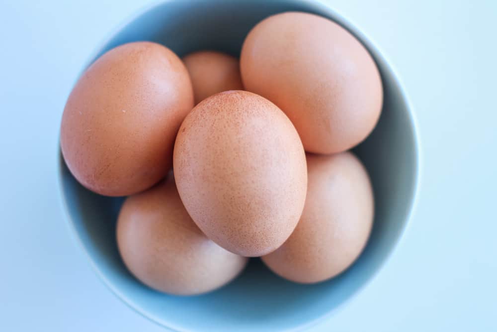 large eggs in a blue bowl.