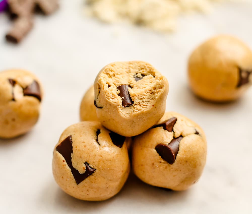cookie dough protein bites on a board.
