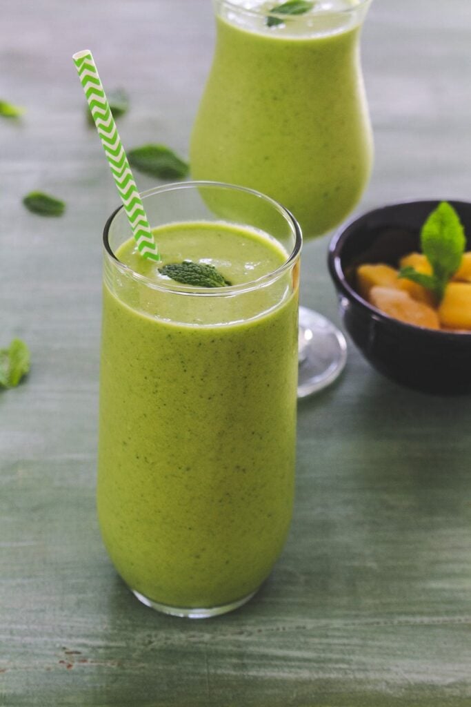 mango mint smoothie in a glass.