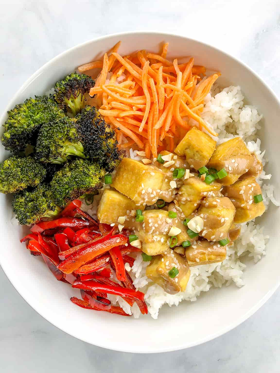 healthy dinner recipe Peanut Tofu Bowls in a dish.