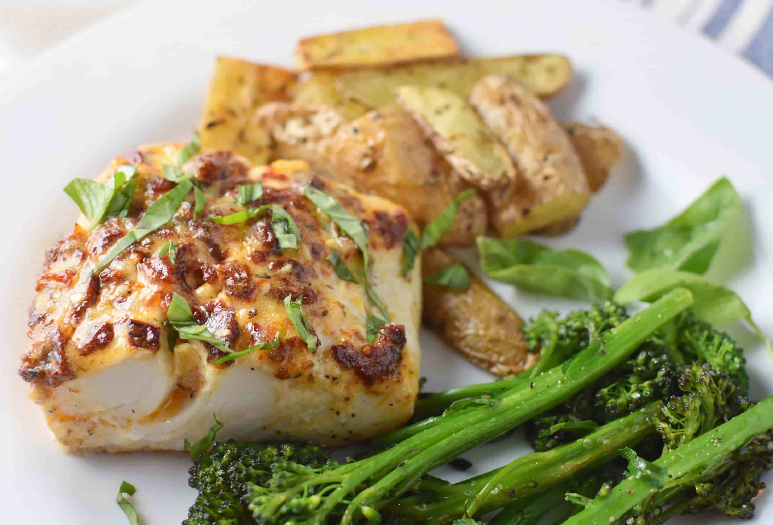 baked halibut on a plate.