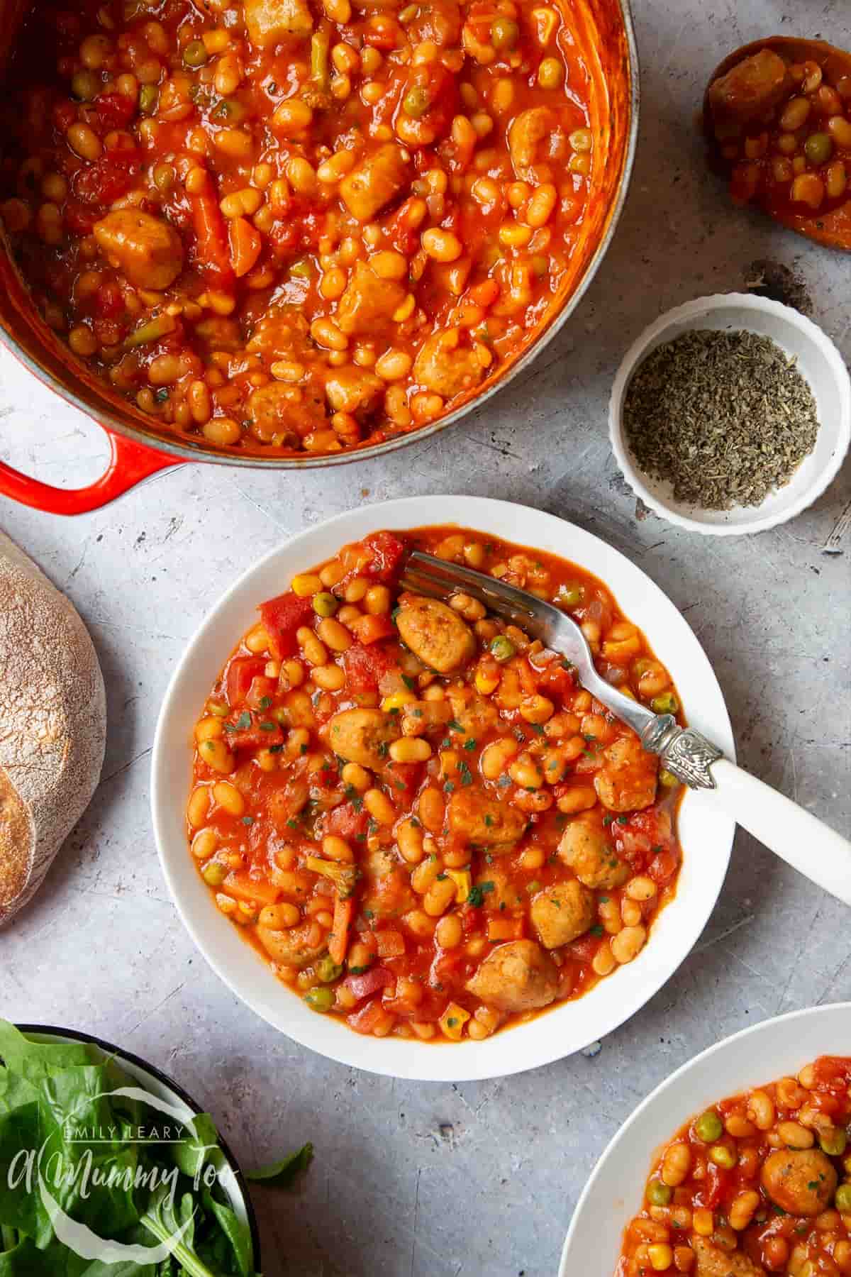 A healthy dinner recipes of veggie sausage and bean casserole in a dish.