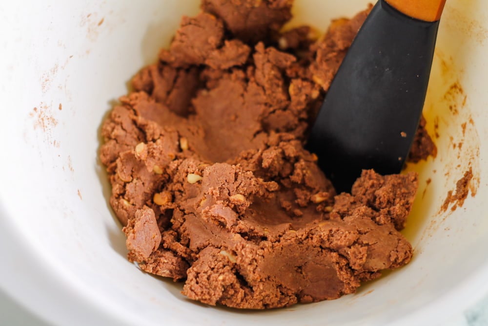 protein bar base being mixed with a spatula.