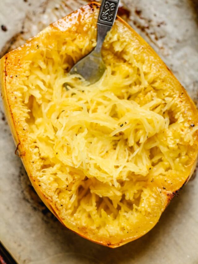 a fork making spaghetti noodles from a roasted squash.