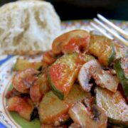 a plate of zucchini and mushrooms.