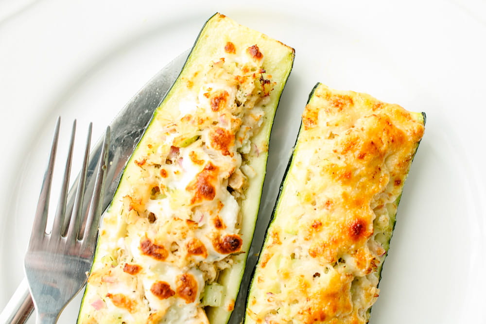 roasted zucchini boats on a plate.