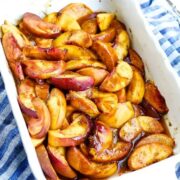 simple baked peaches in a dish.