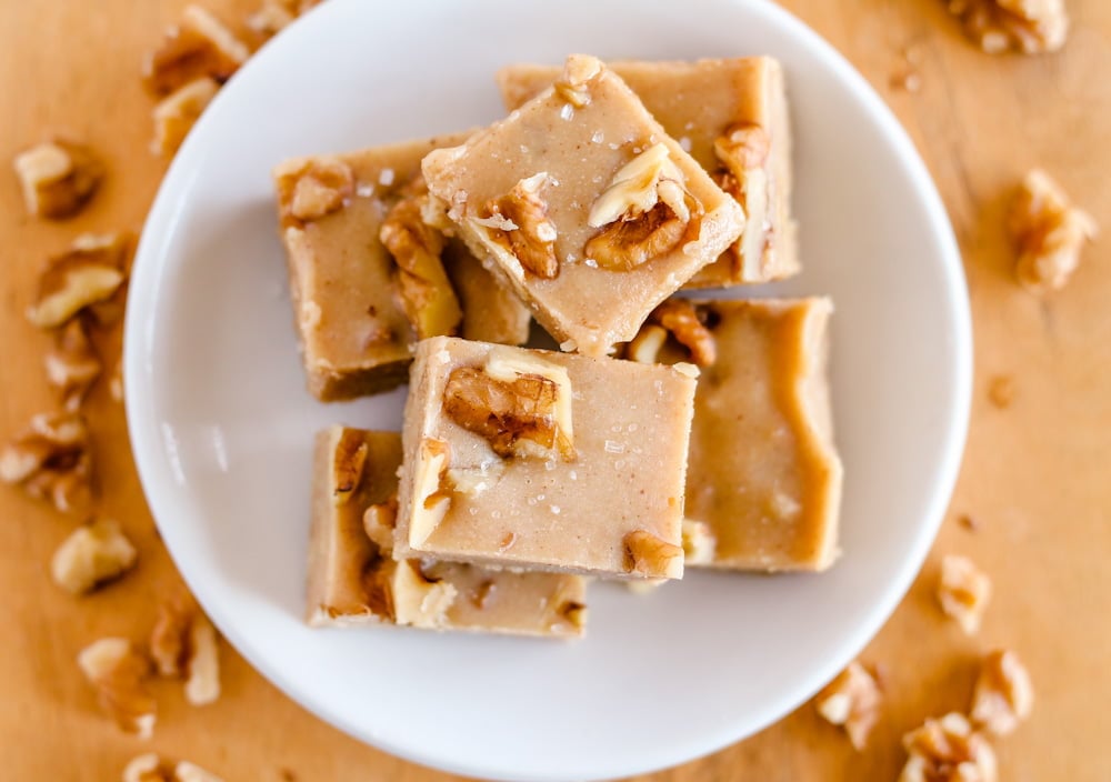 overhead image of tahini fudge squares on a plate.