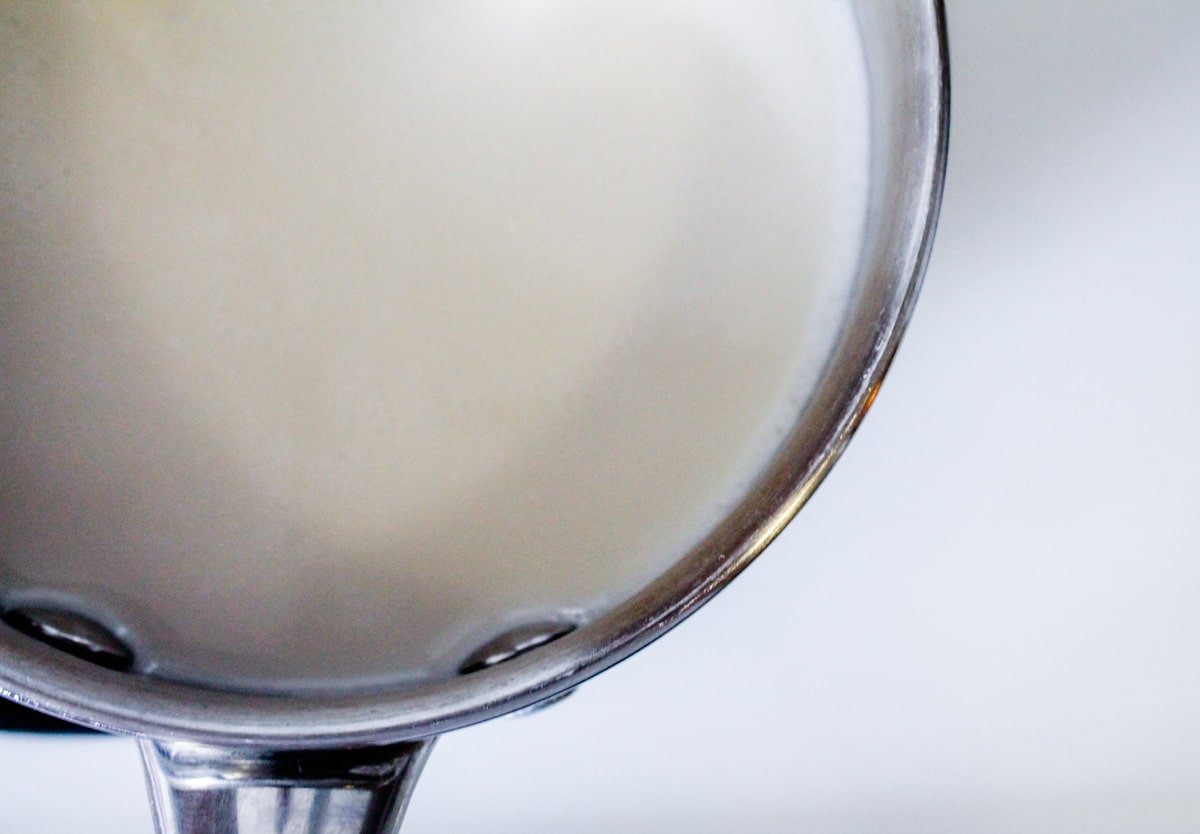 almond milk warming in a small saucepan.