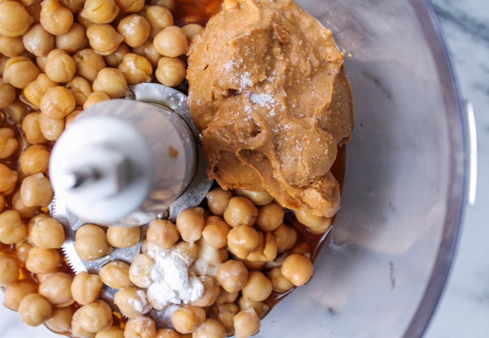 a food processor with chickpeas and maple syrup.