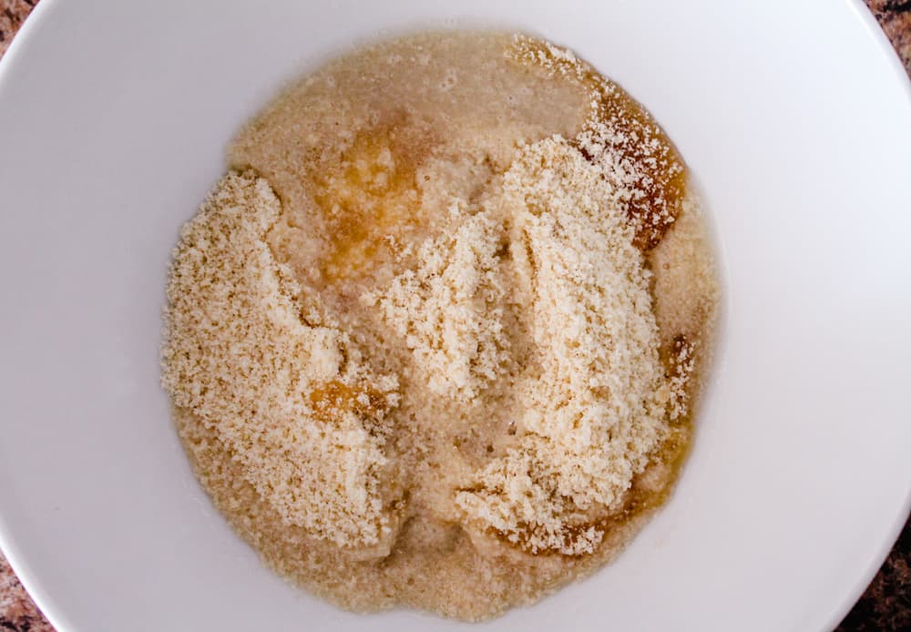 bowl of almond flour, maple syrup and coconut oil.
