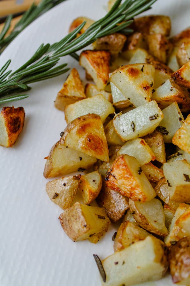 a plate of roasted rosemary potatoes.