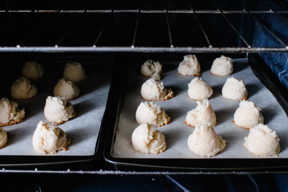 vegan coconut macaroons baking in an oven.