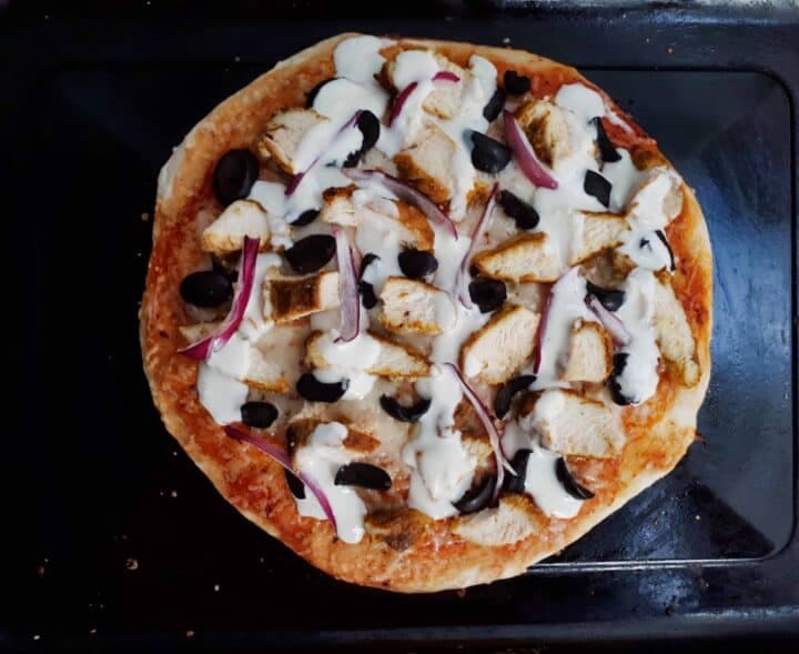 chicken shawarma pizza on a plate.