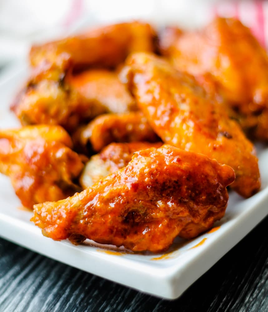 a plate of baked chicken wings.