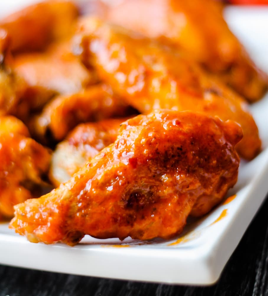 a plate of baked chicken wings.