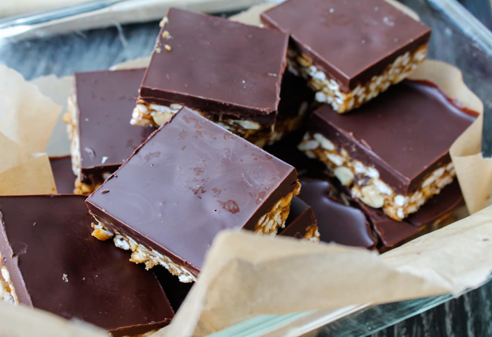 crunchy peanut butter bars in a container.
