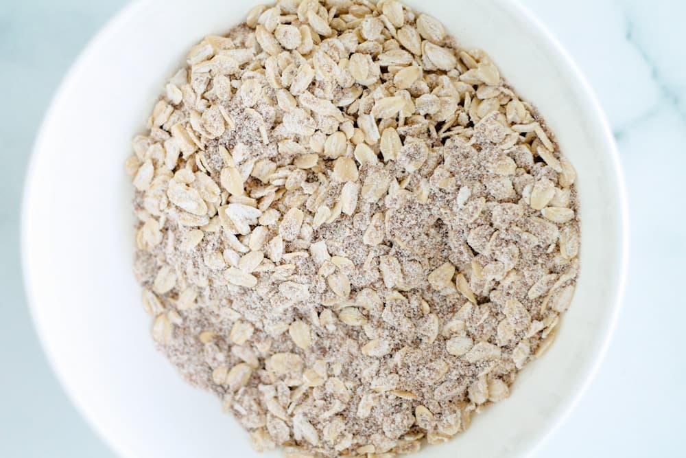 oats, flour and sugar in a bowl.
