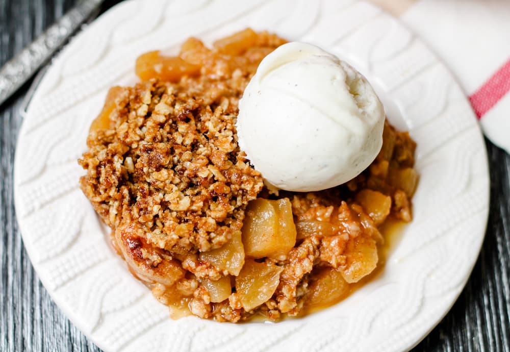 a plate of instant pot apple crumble.