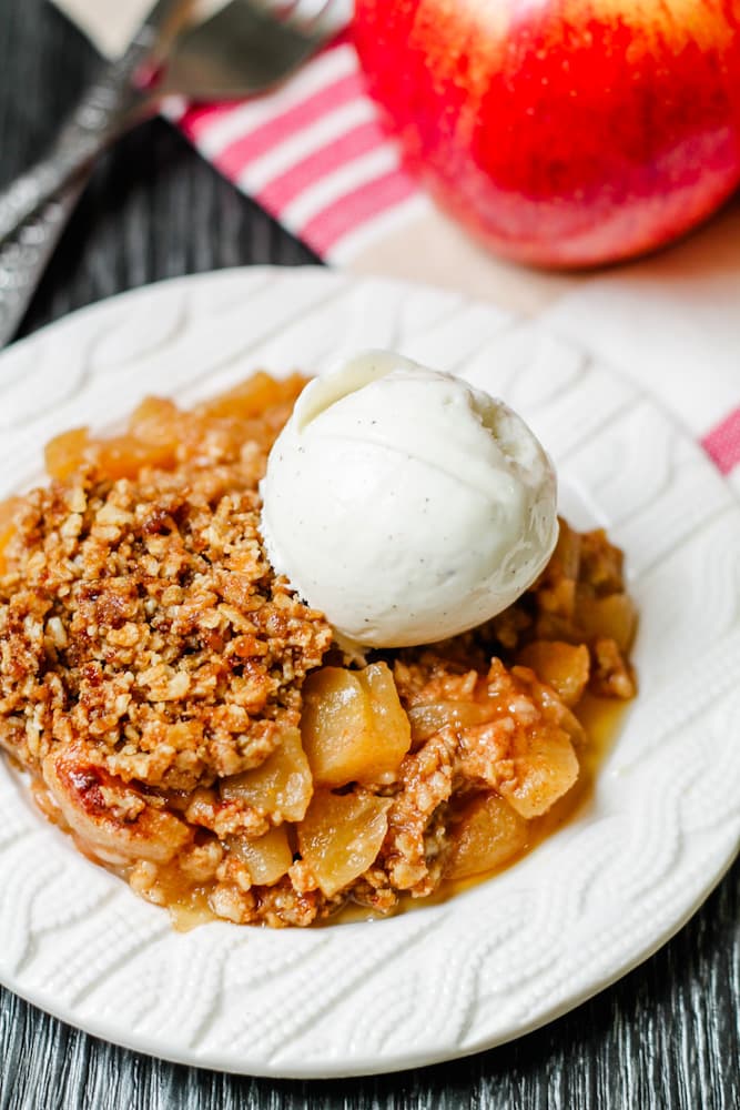 a plate of instant pot apple crumble.