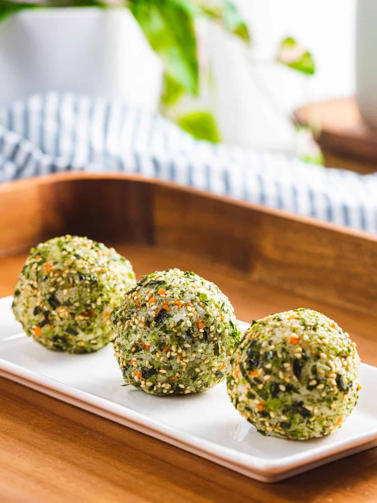 korean rice balls on a plate.