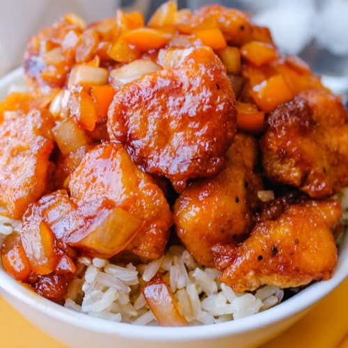 a bowl of gluten free sweet and sour chicken.