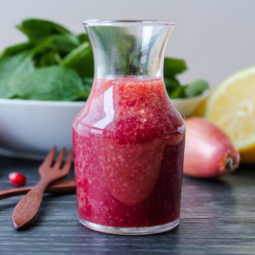 a jar of pomegranate salad dressing.