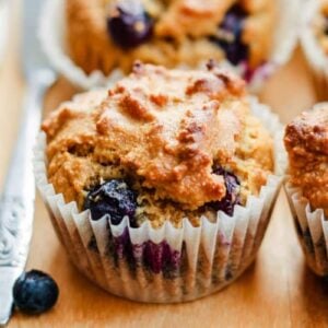 almond flour blueberry muffins on a table.