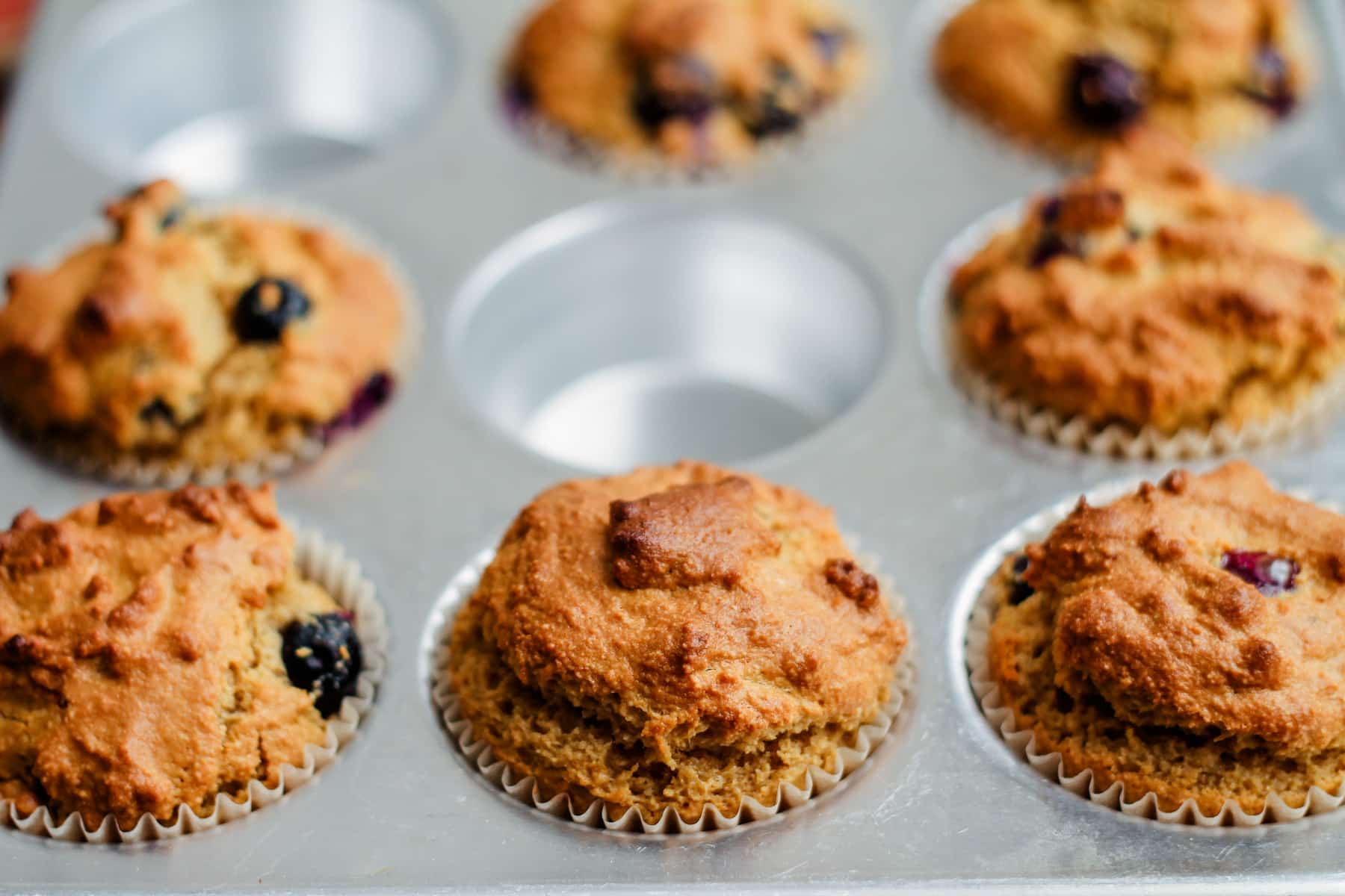 freshly baked muffins in a muffin pan.
