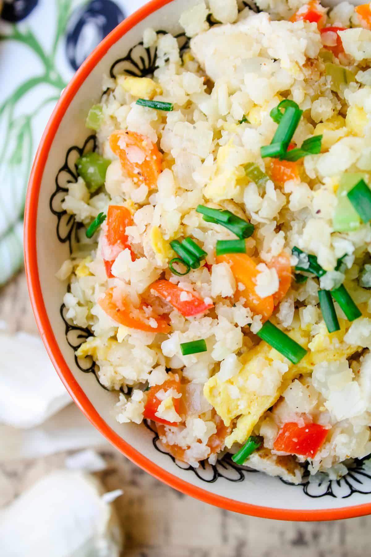 A bowl of chicken cauliflower fried rice.