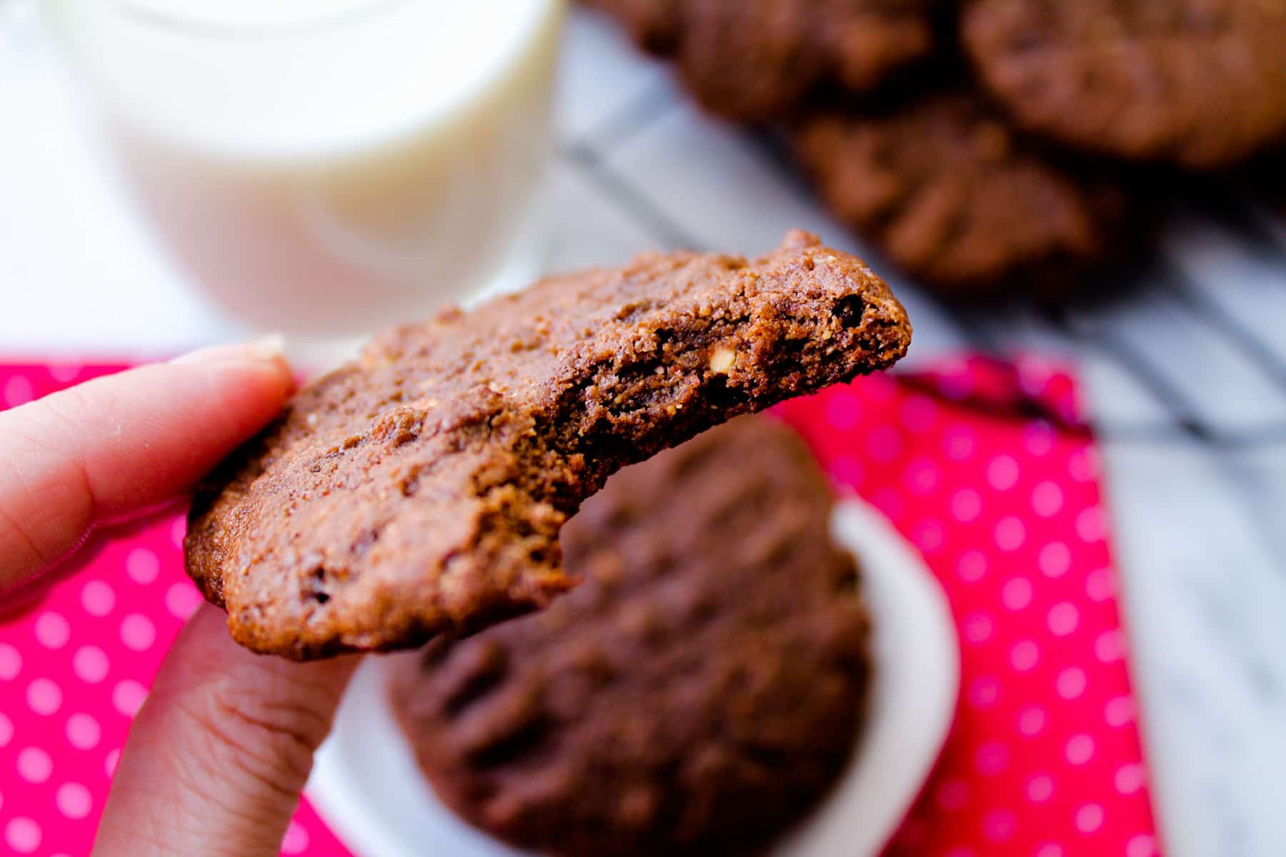 chocolate protein cookie with a bite out of it.