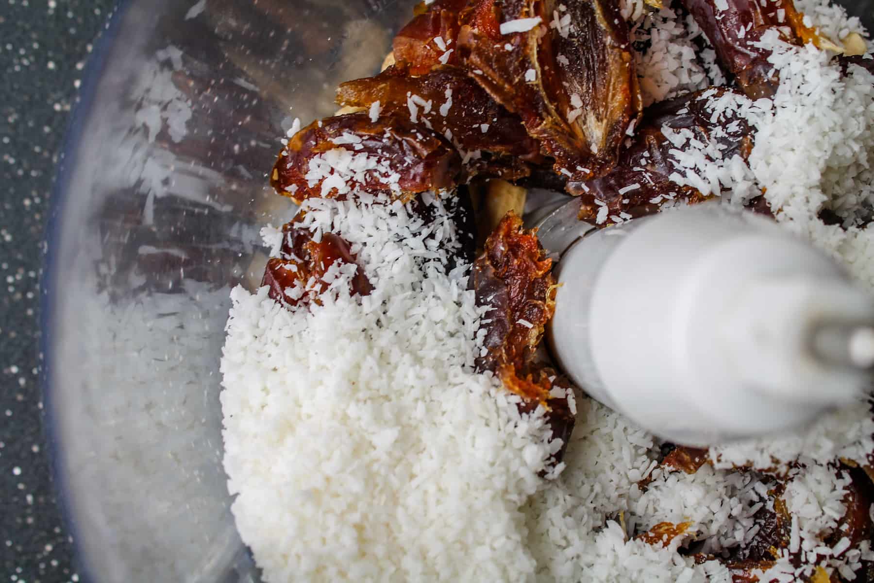 dates and coconut in a food processor.